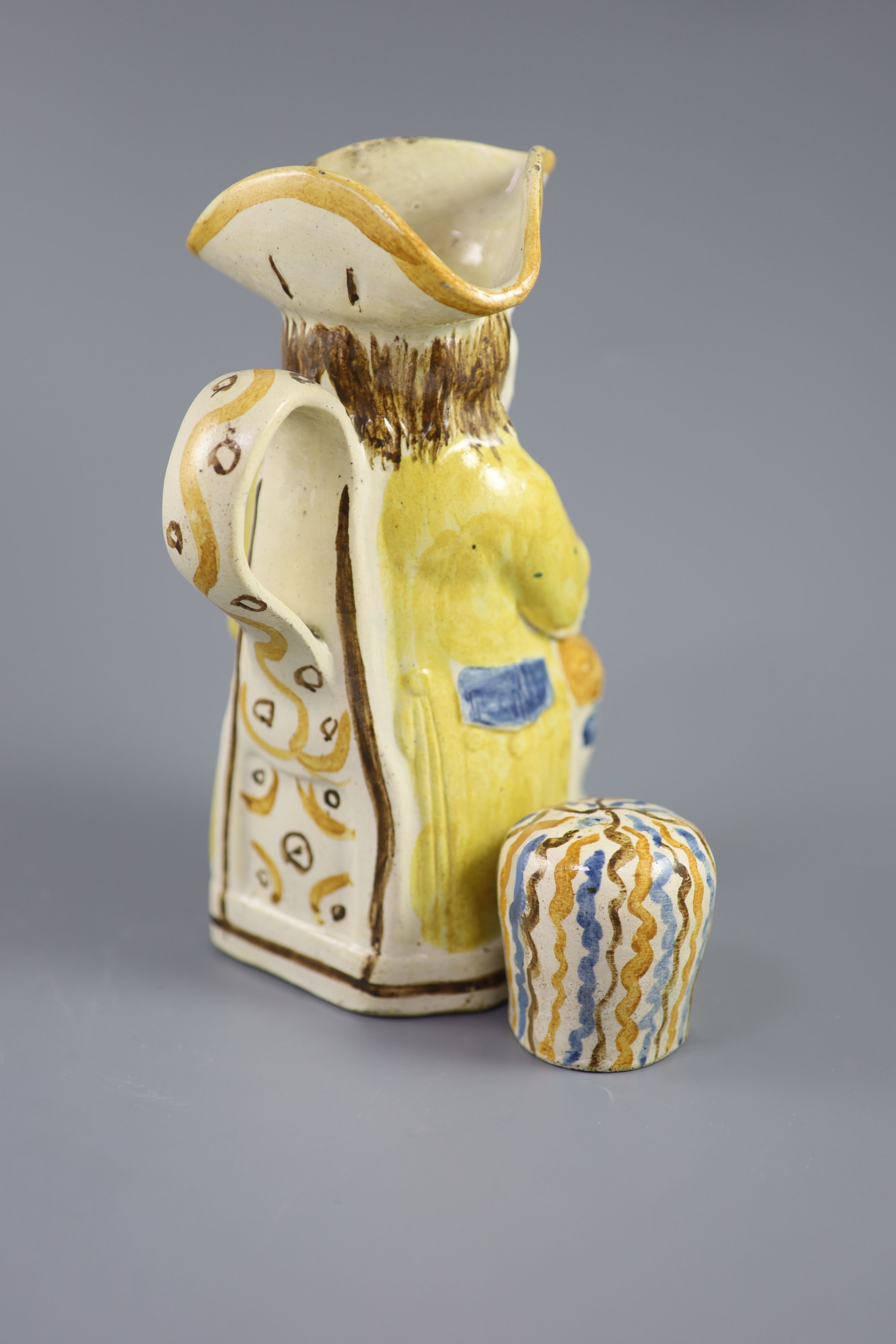 A Staffordshire Prattware Good Hearty Fellow Toby jug with rare hat measure, c.1790-1800, 25cm high